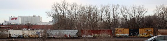 Nebraska, Graffiti'd freight train outside factory